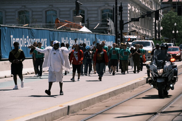 Juneteenth Celebration goers walk from the Utah State Capitol